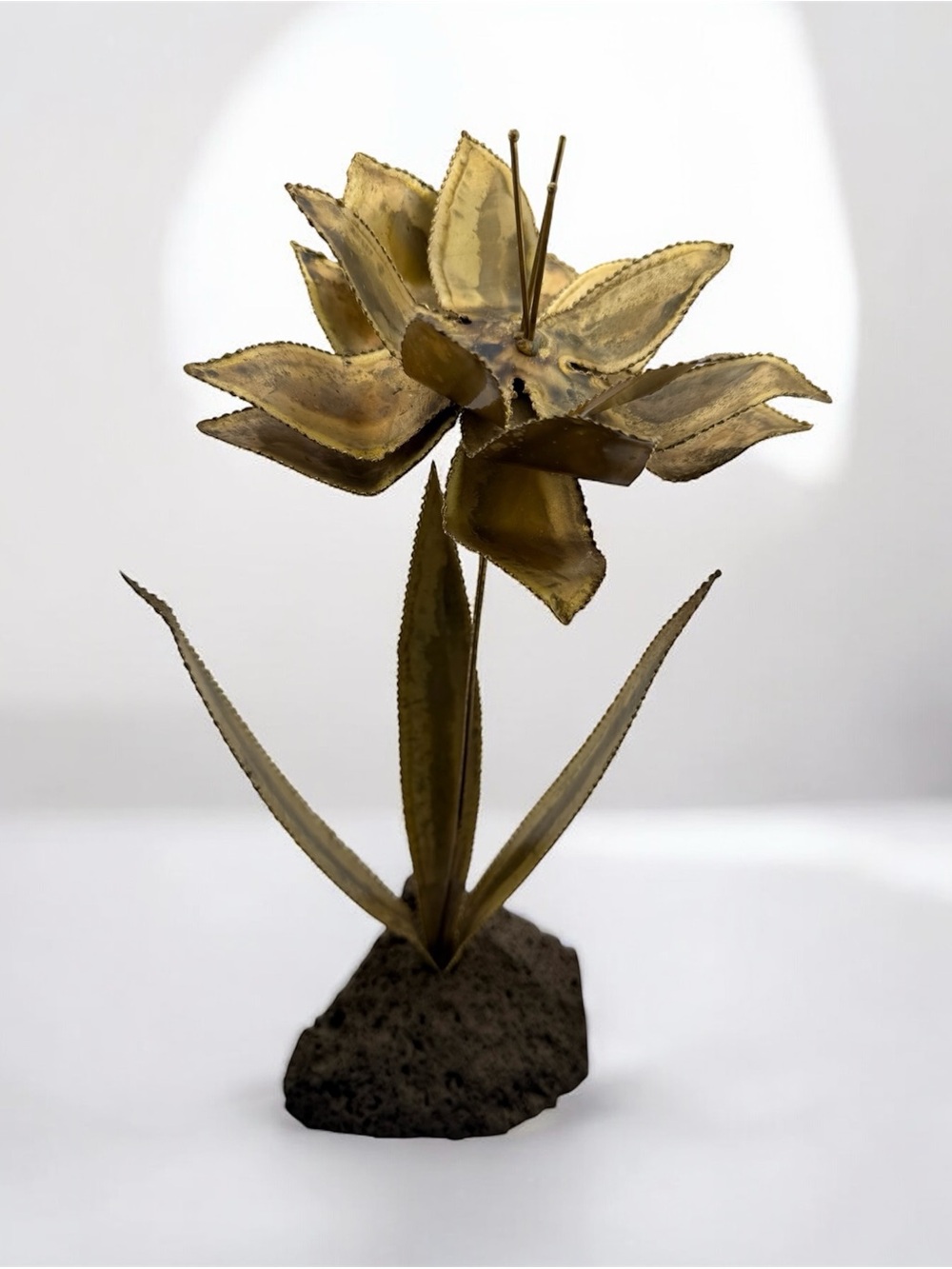 Vintage Brutalist Torch-Cut Metal Flower Sculpture with Lava Rock Base Gold Tone